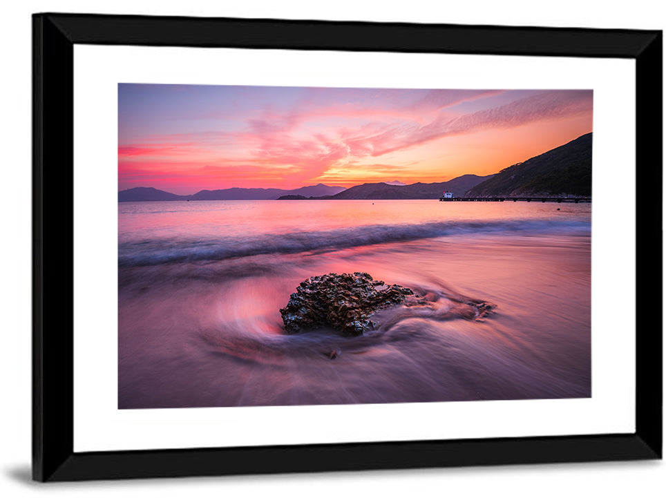 Pink Sunset Over Rock and Pier Wall Art
