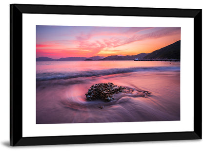 Pink Sunset Over Rock and Pier Wall Art
