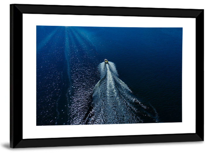 Aerial Boat Over Deep Blue Water Wall Art as a framed print