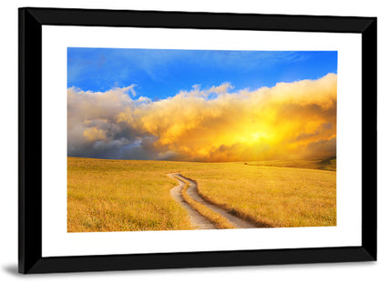 Sunlit Meadow Path with Dramatic Clouds Wall Art