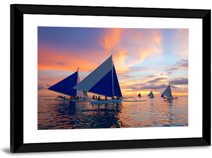 Outrigger Sailboats at Sunset Wall Art as a framed print