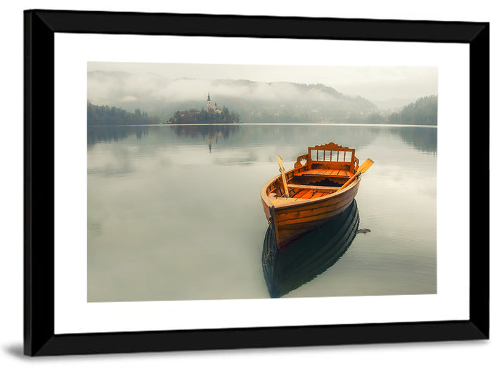 Wooden Boat on Misty Lake Bled Wall Art as a framed print