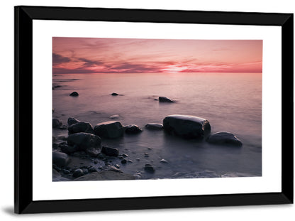 Pink Dusk Lakeshore with Silhouetted Rocks Wall Art