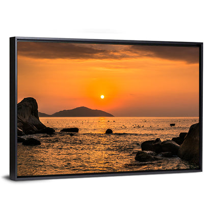 Orange Sunrise Over Rocky Coast Wall Art