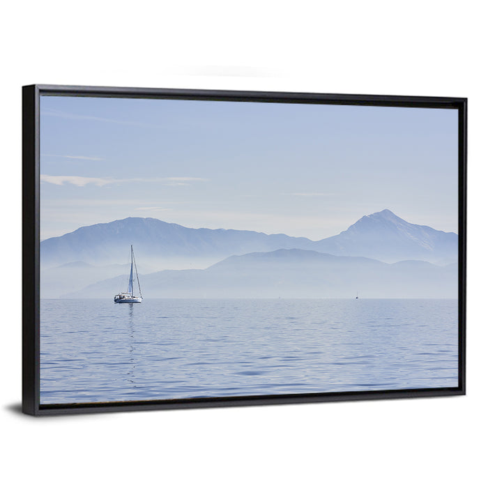 Sailboat and Misty Mountains Wall Art as a framed canvas