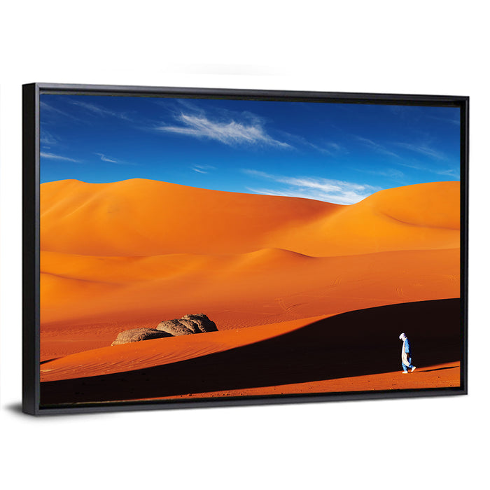 Solitary Figure on Sahara Dunes Wall Art as a framed canvas