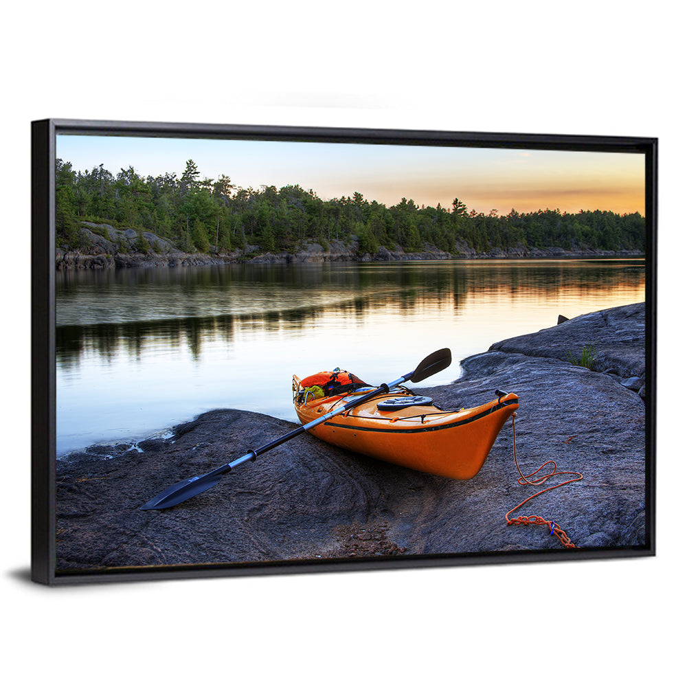Orange Kayak on Rocky Shore Wall Art