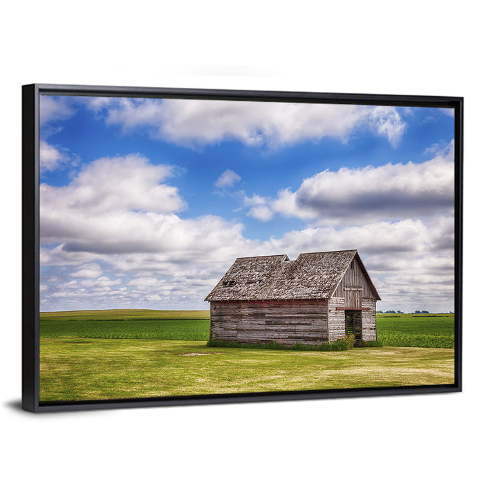 Old Farm Shed in Field Wall Art as a framed canvas