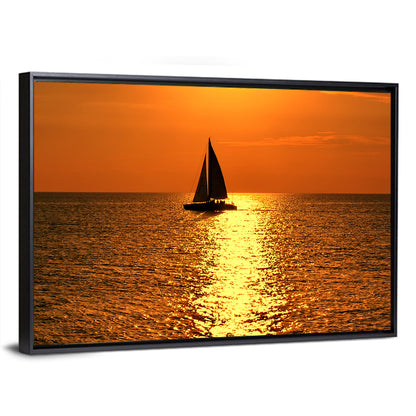 Sailboat Silhouette at Golden Sunset Wall Art