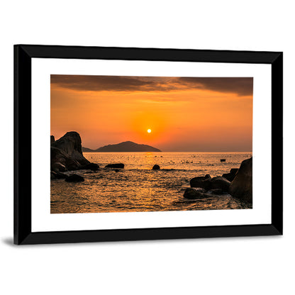 Orange Sunrise Over Rocky Coast Wall Art