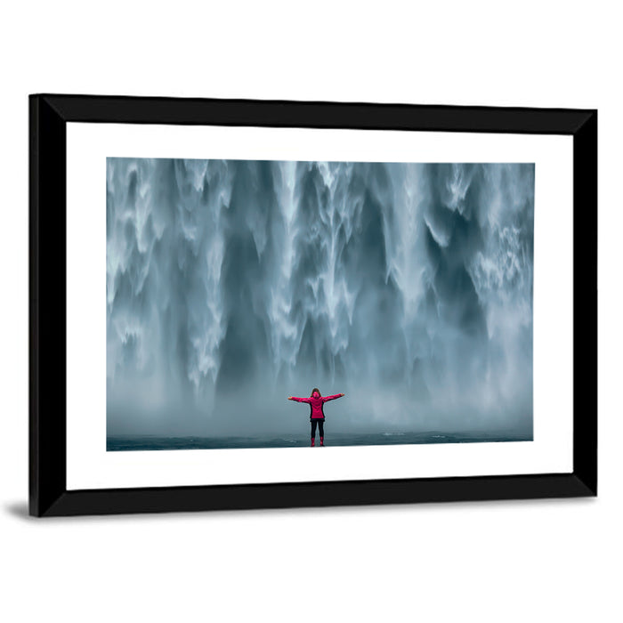 Skogafoss Waterfall with Figure in Pink Wall Art as a framed print