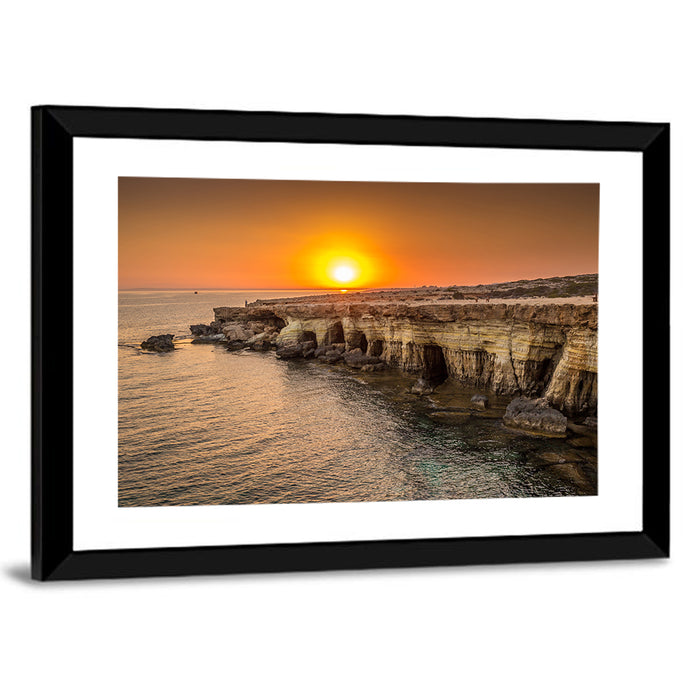 Sunset Over Sea Caves Wall Art as a framed print