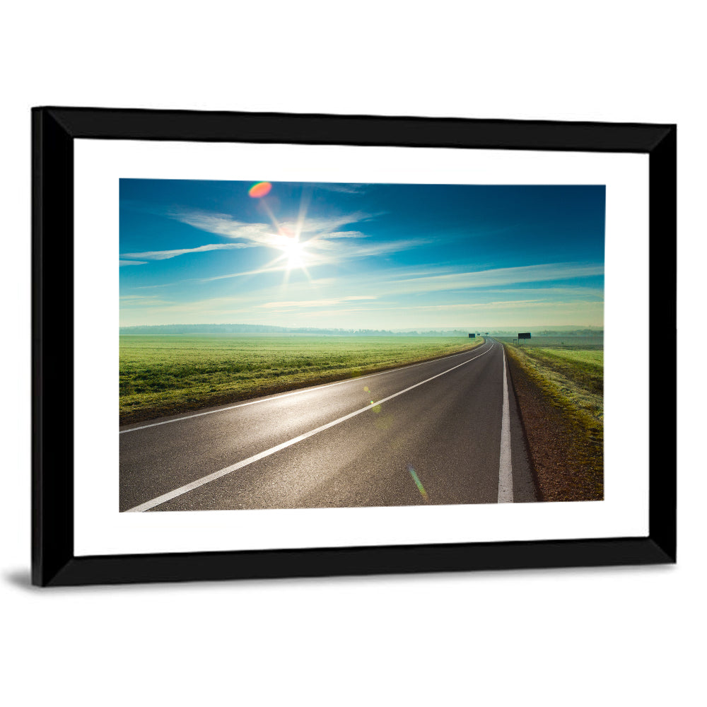 Sunlit Road Through Green Field Wall Art