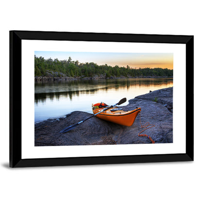 Orange Kayak on Rocky Shore Wall Art