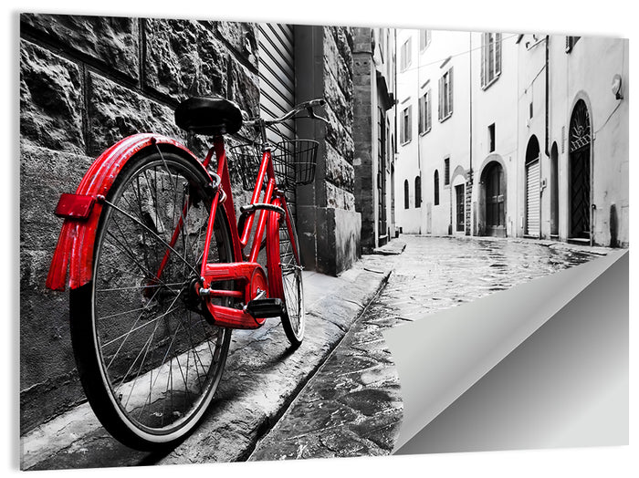 Red Bicycle on Rainy Cobblestone Street Wall Art as a poster print