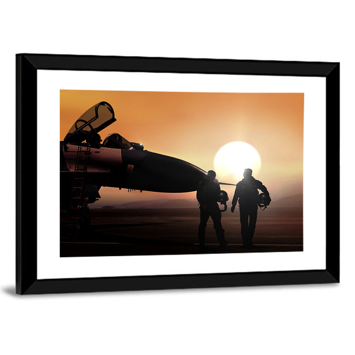 Pilots and Supersonic Jet at Sunset Wall Art as a framed print