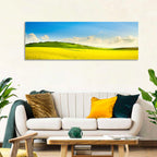 Rapeseed Field and Rolling Hills Under Blue Sky Wall Art