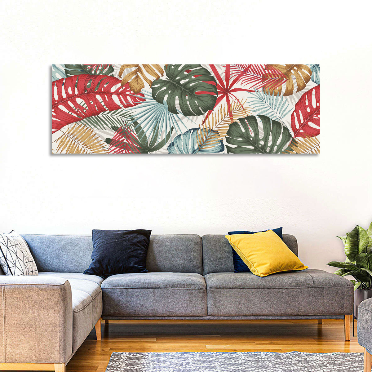 Red and Green Tropical Leaves Pattern Wall Art in a room, panoramic