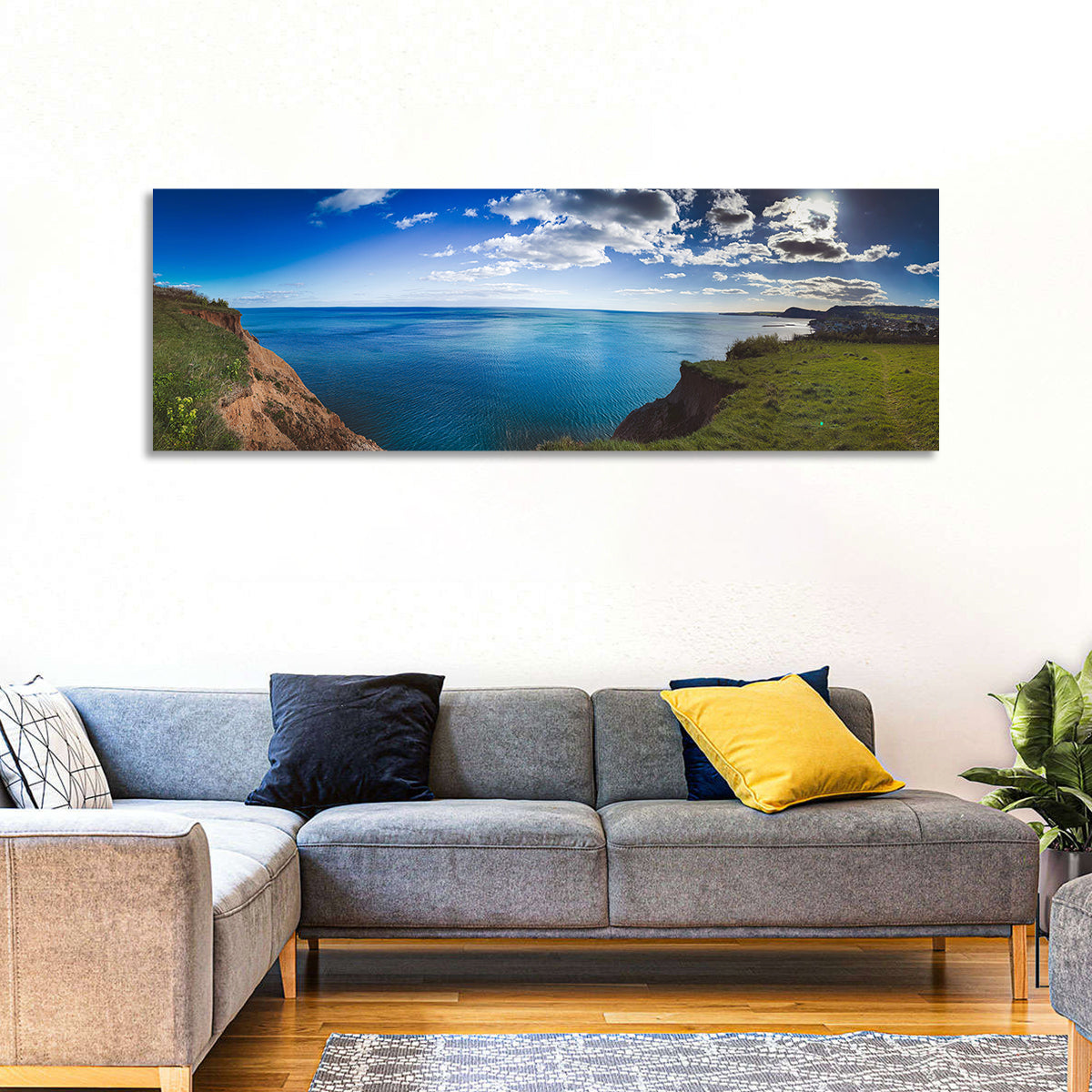 Sidmouth Cliffs and Sea View Wall Art in a room, panoramic