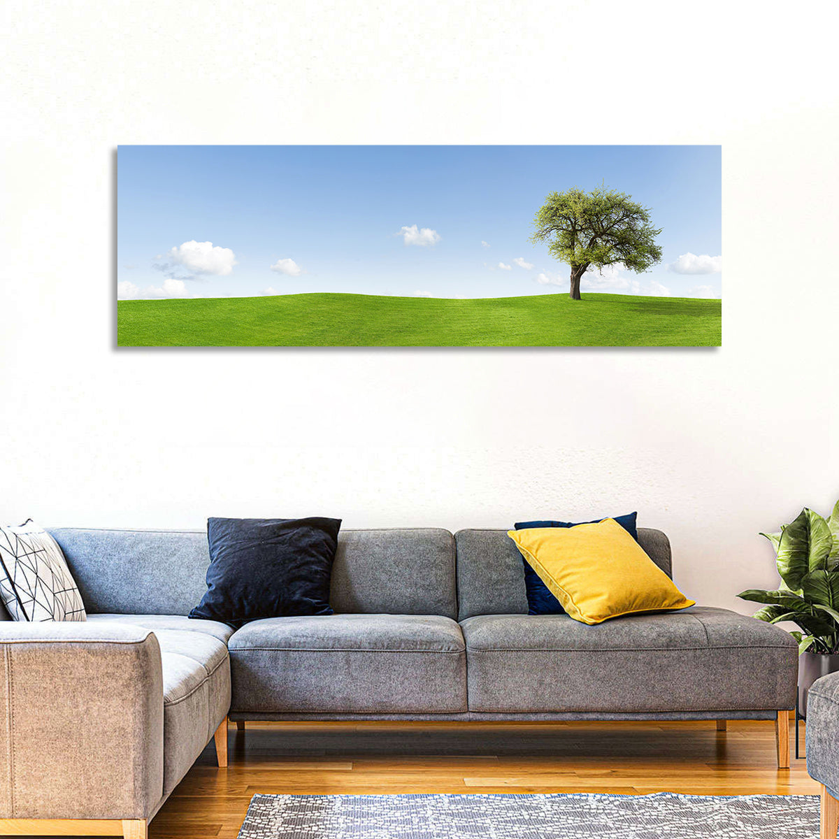 Lone Tree on Green Hill Wall Art in a room, panoramic