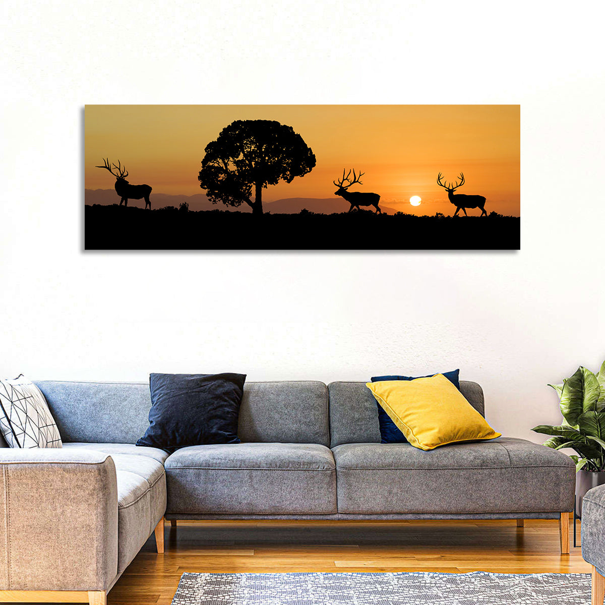 Bull Elk Sunset Silhouette Wall Art in a room, panoramic
