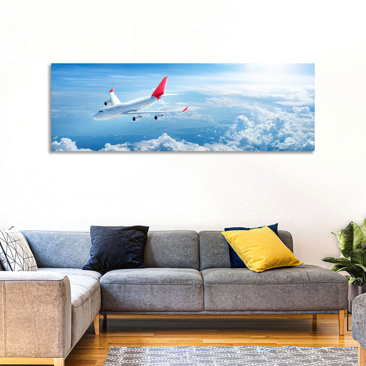 Airplane Over Blue Cloudscape Wall Art in a room, panoramic