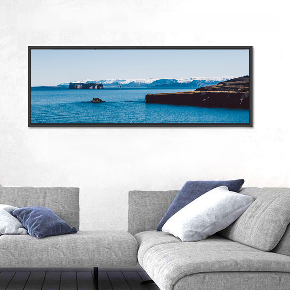 Calm Blue Lake with Coastal Cliffs Wall Art in a room, panoramic