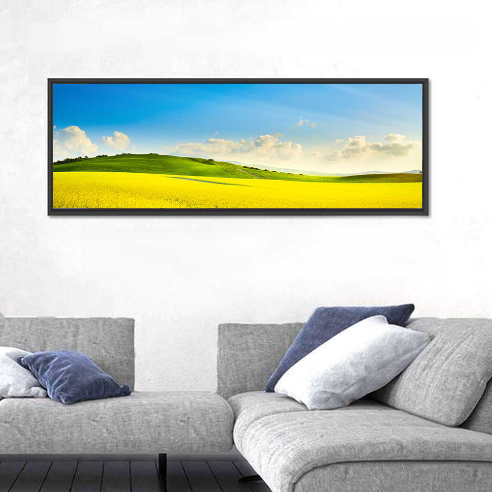 Rapeseed Field and Rolling Hills Under Blue Sky Wall Art