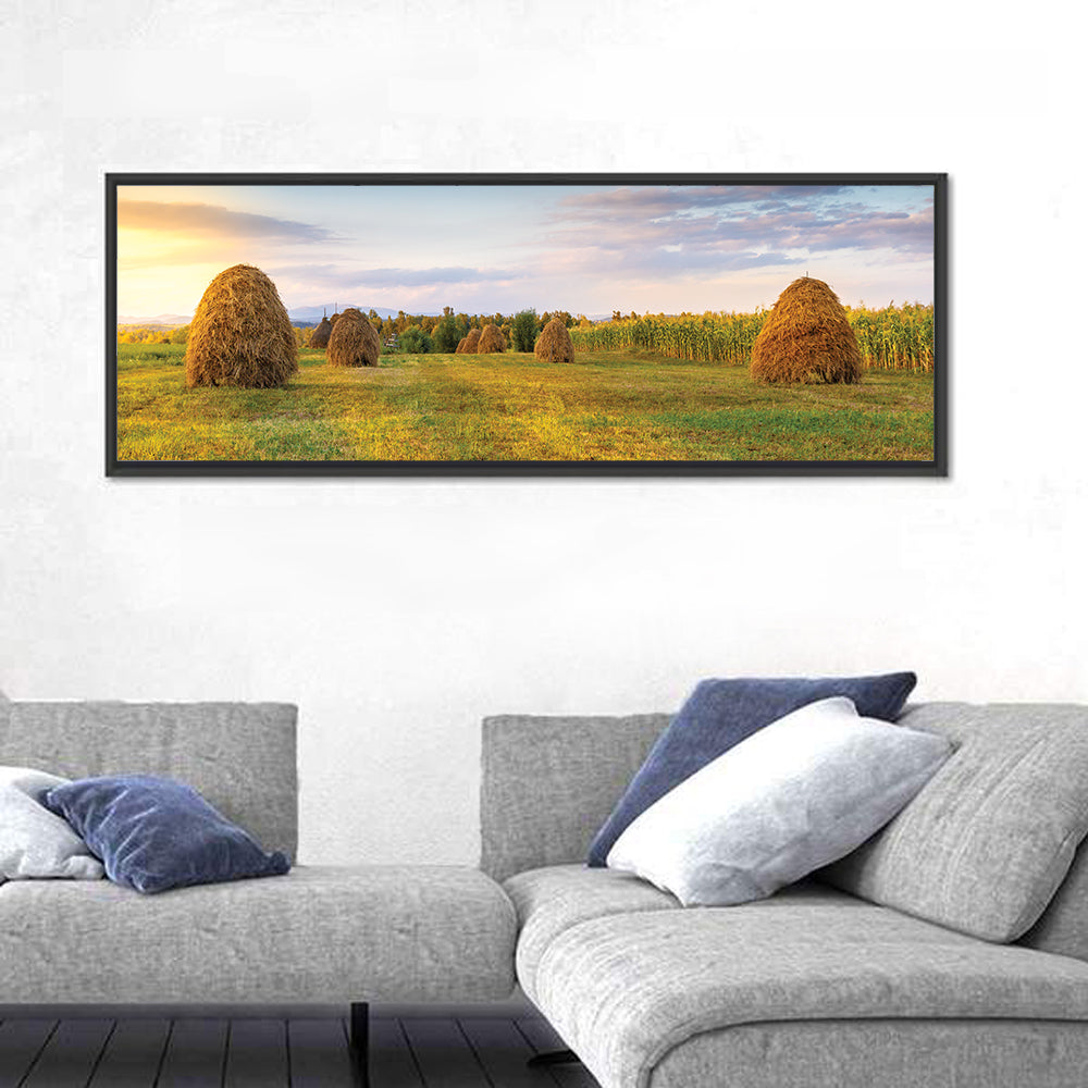 Haystacks at Sunset Fieldscape Wall Art in a room, panoramic