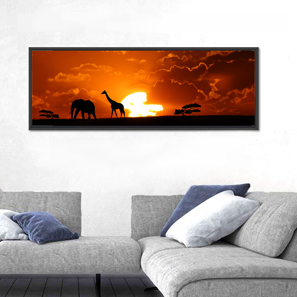 Safari Sunset Silhouettes Wall Art in a room, panoramic