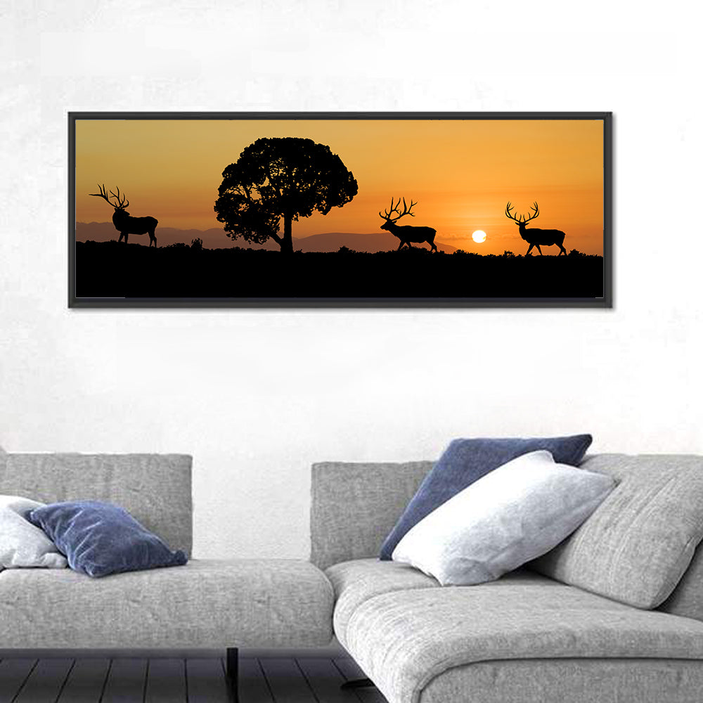 Bull Elk Sunset Silhouette Wall Art in a room, panoramic