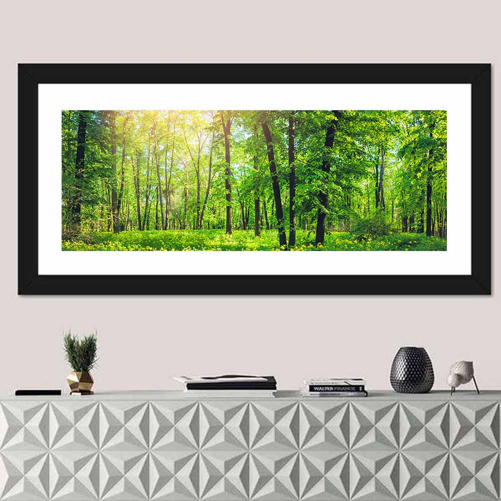Sunlit Green Forest with Yellow Wildflowers Wall Art in a room, panoramic