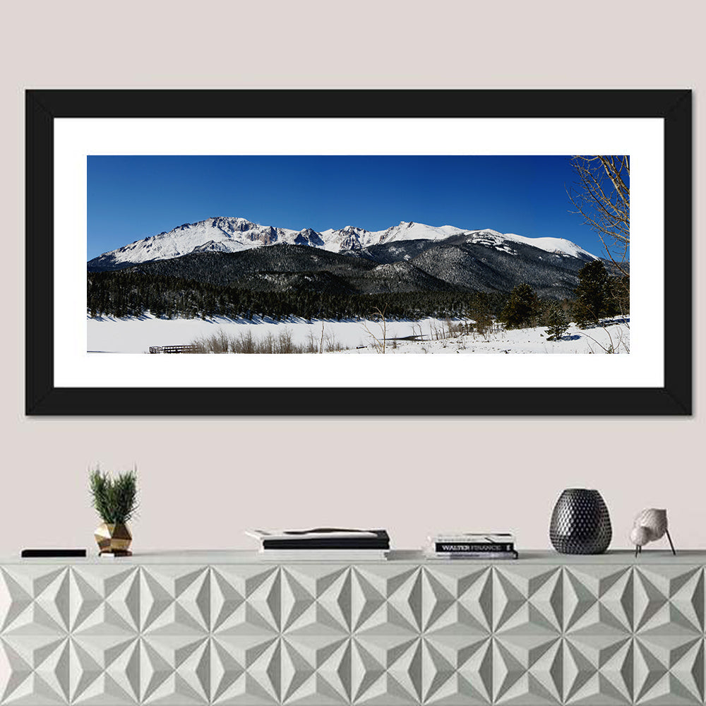 Pikes Peak Winter View Wall Art in a room, panoramic