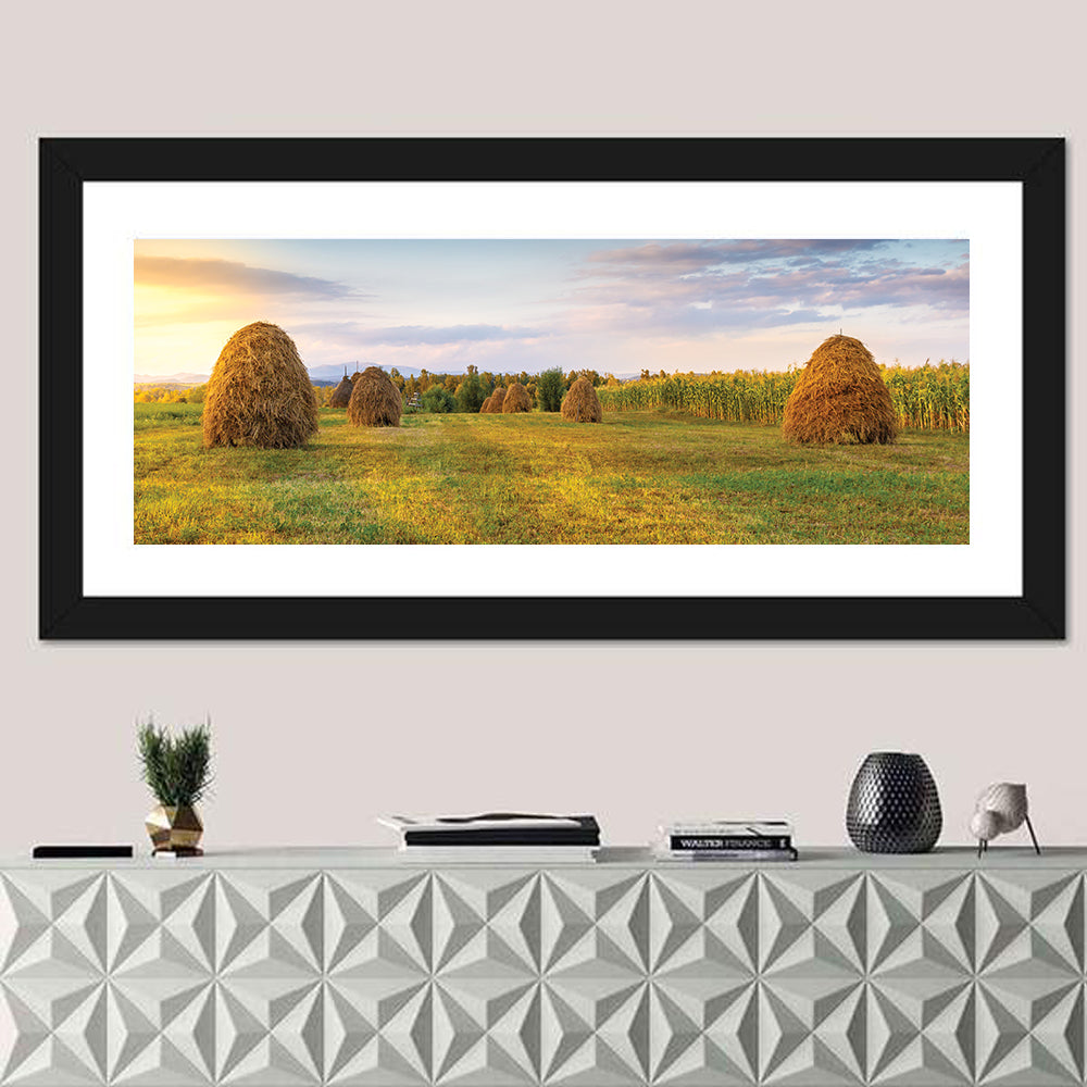 Haystacks at Sunset Fieldscape Wall Art in a room, panoramic