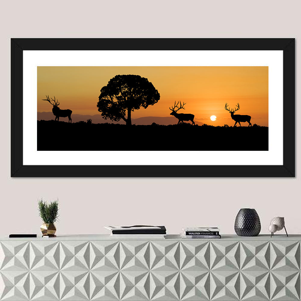 Bull Elk Sunset Silhouette Wall Art in a room, panoramic