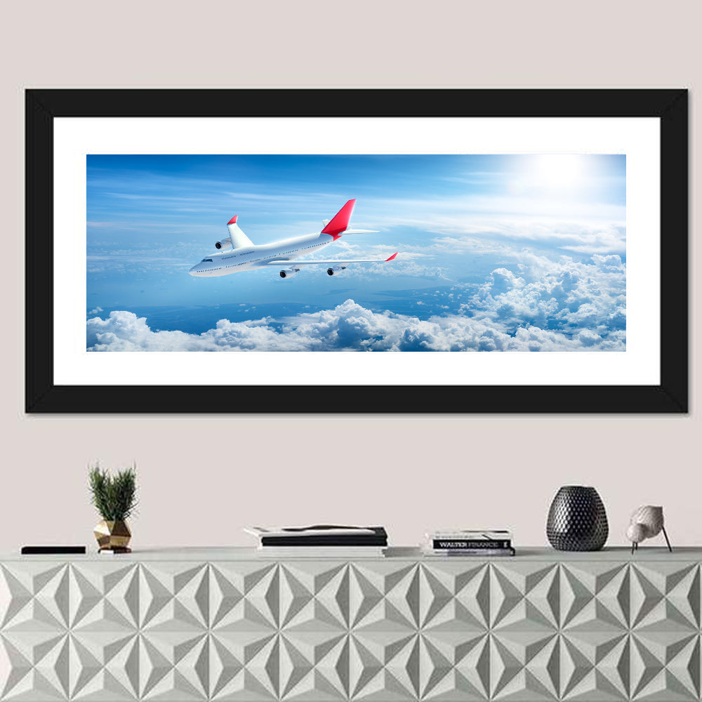 Airplane Over Blue Cloudscape Wall Art in a room, panoramic
