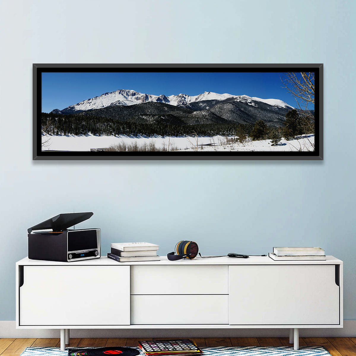 Pikes Peak Winter View Wall Art in a room, panoramic