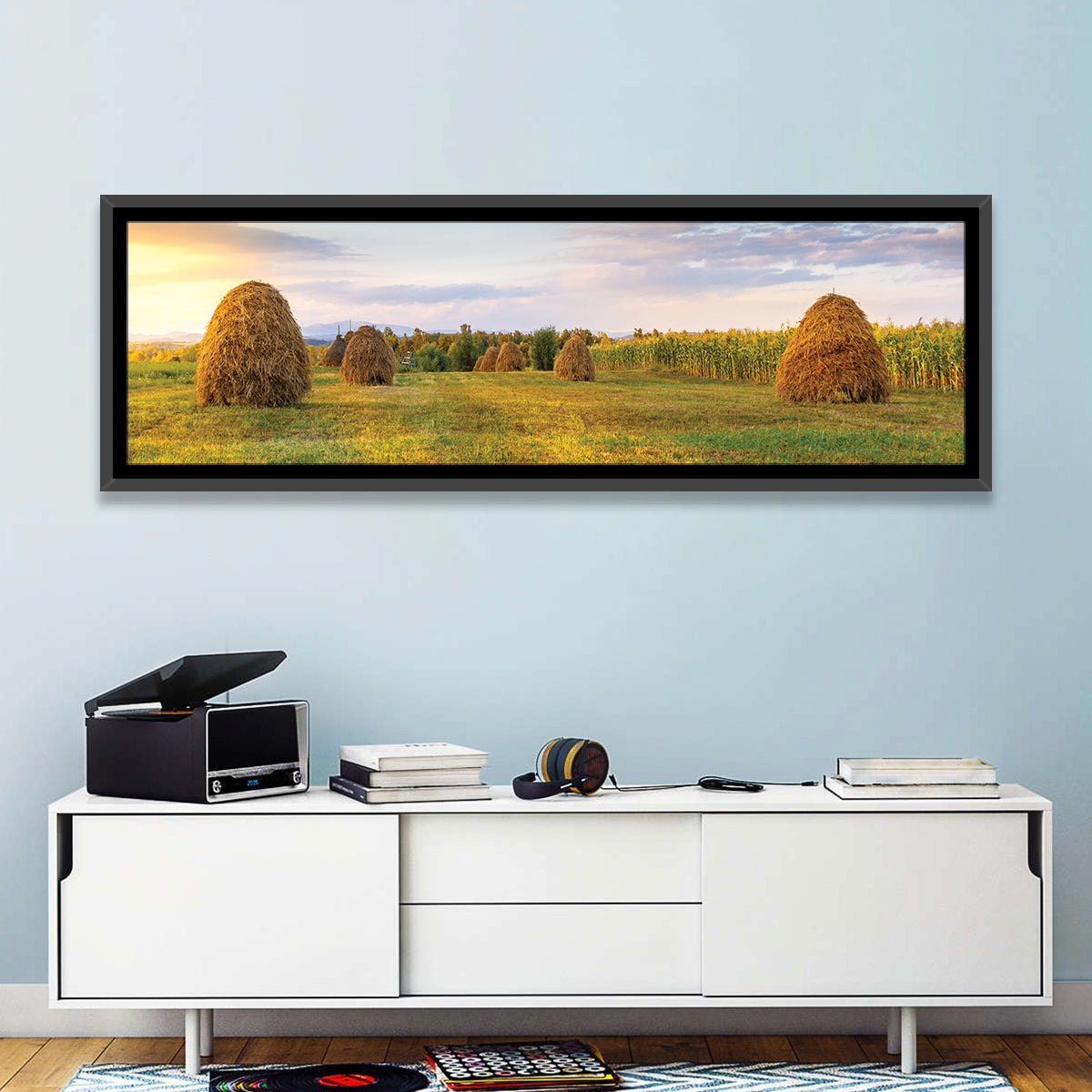 Haystacks at Sunset Fieldscape Wall Art in a room, panoramic