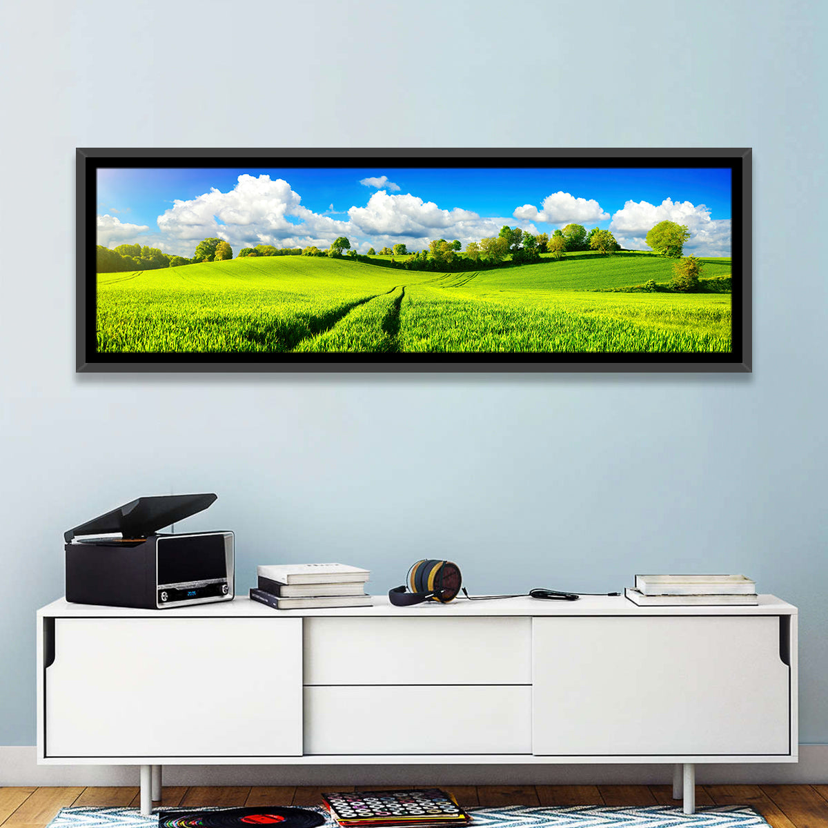 Tractor Tracks Through Green Rolling Hills Wall Art in a room, panoramic