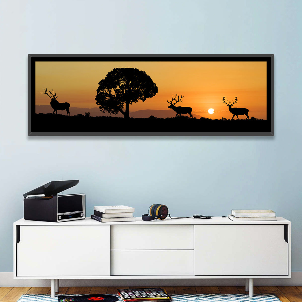 Bull Elk Sunset Silhouette Wall Art in a room, panoramic