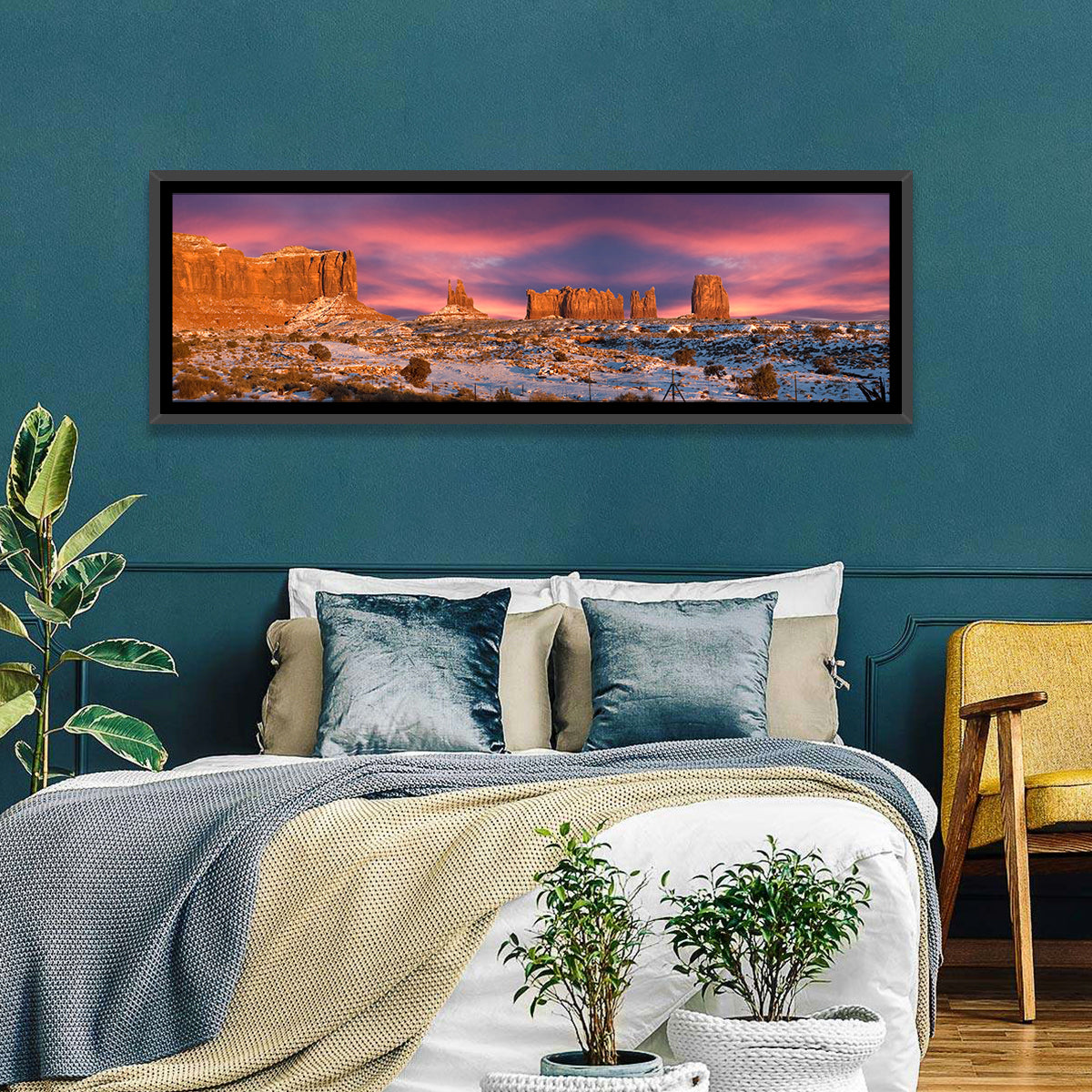 Snow-dusted Monument Valley Sunset Wall Art in a room, panoramic