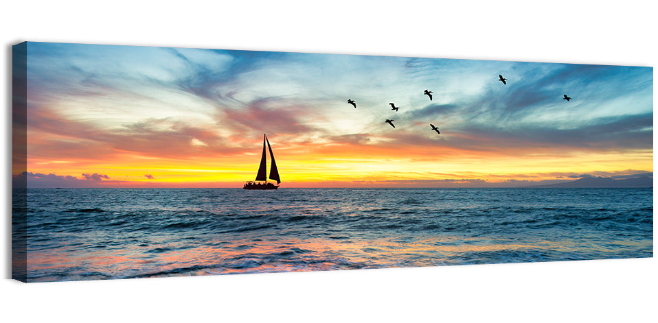 Sunset Sailboat Over Pebble Shore Wall Art