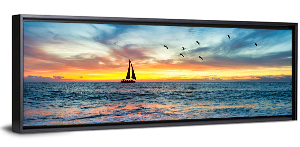 Sunset Sailboat Over Pebble Shore Wall Art