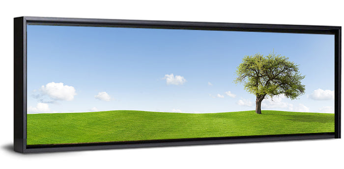 Lone Tree on Green Hill Wall Art as a framed canvas