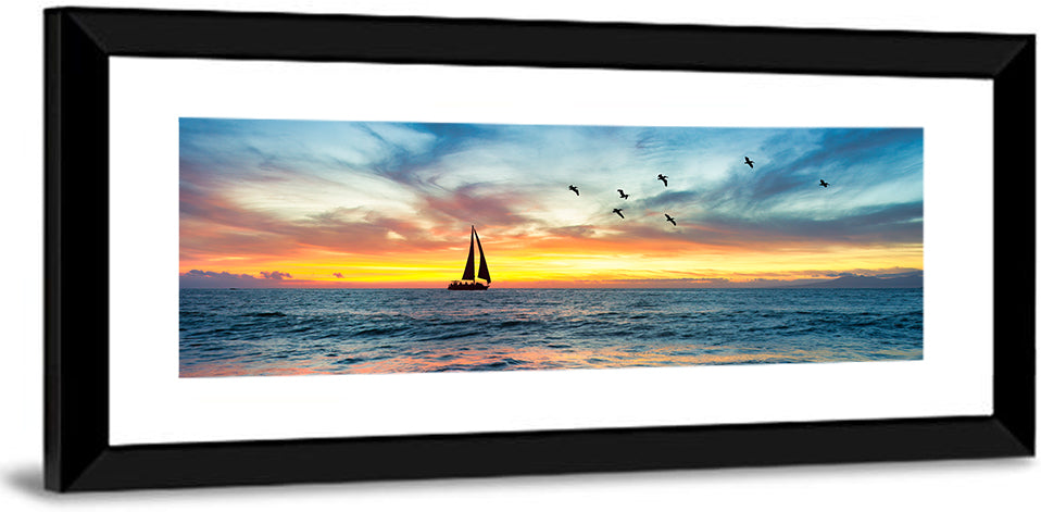 Sunset Sailboat Over Pebble Shore Wall Art