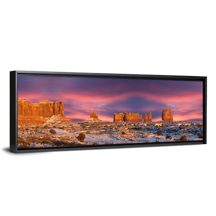 Snow-dusted Monument Valley Sunset Wall Art as a framed canvas