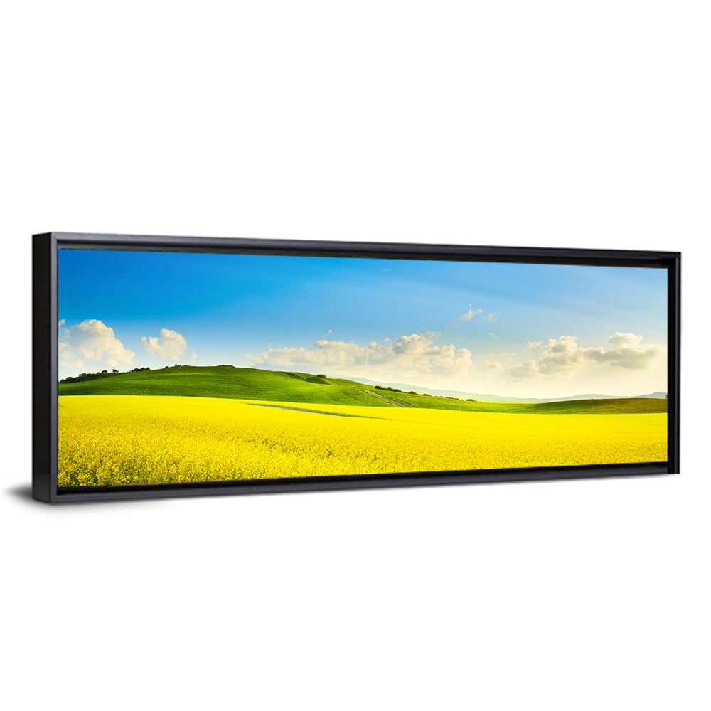 Rapeseed Field and Rolling Hills Under Blue Sky Wall Art