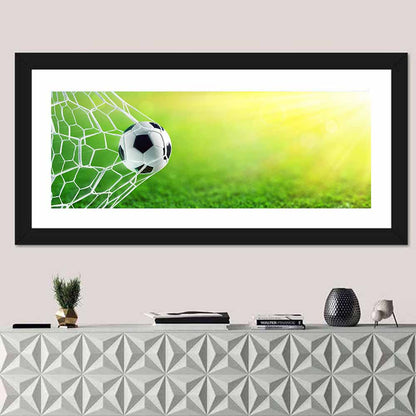 Sunlit Soccer Ball in Net Wall Art