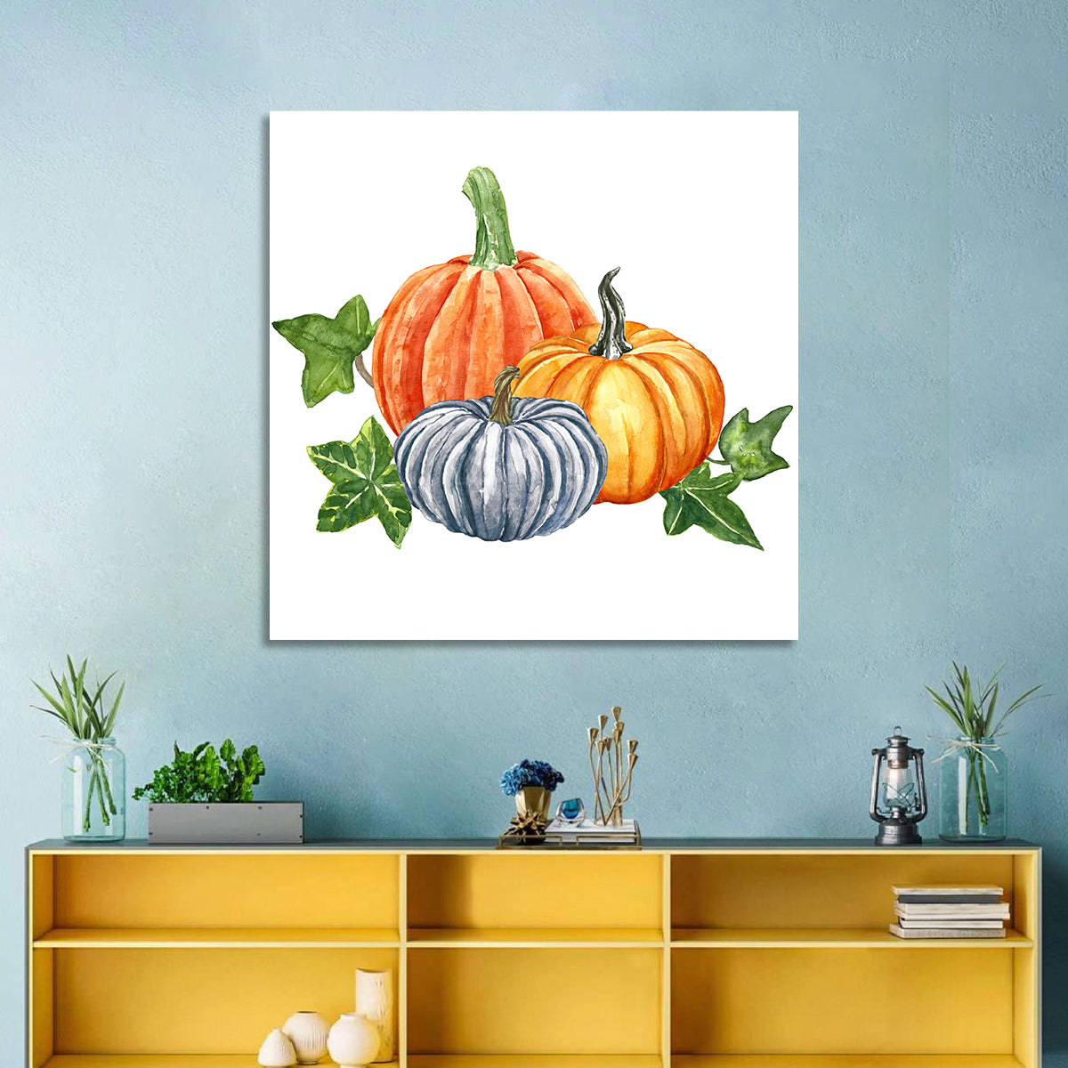Festive Pumpkin Trio Watercolor Wall Art in a room, square