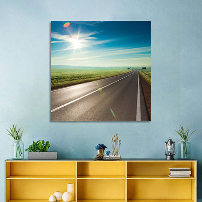 Sunlit Road Through Green Field Wall Art